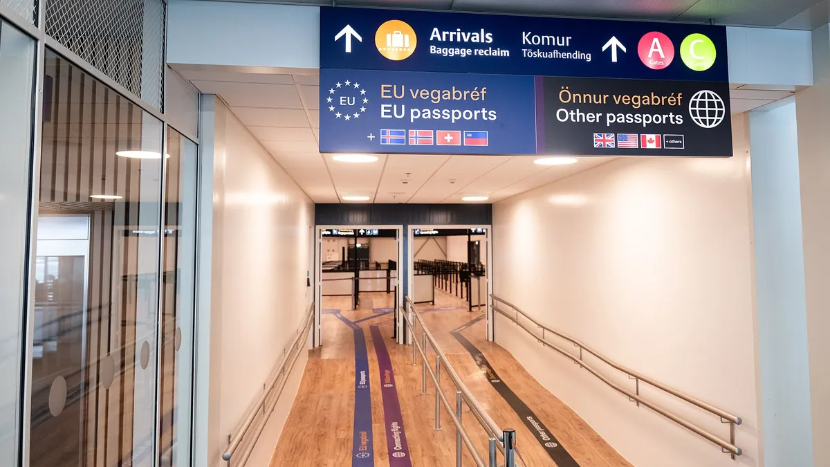 Signs for EU passports and other passports at passport control in Keflavík airport, Iceland