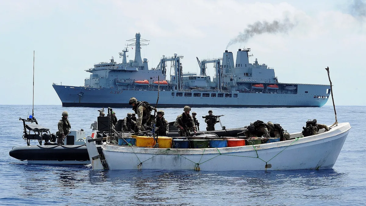 Archive photo: Royal Navy personnel board a boat suspected of use by pirates off the Horn of Africa