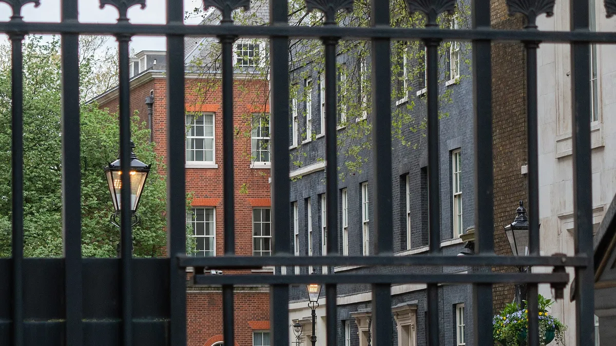 Downing Street in London seen through its black security gates